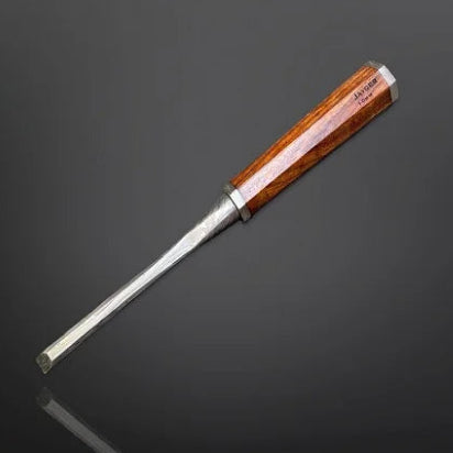 Wood chisel with wooden handle on a dark background