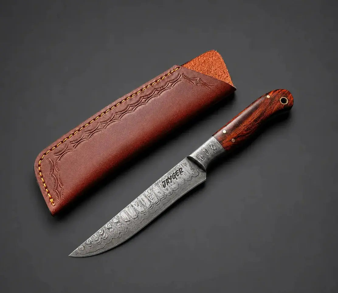 A Damascus steel knife with a reddish-brown wooden handle and a brown leather sheath, displayed diagonally on a dark gray background.
