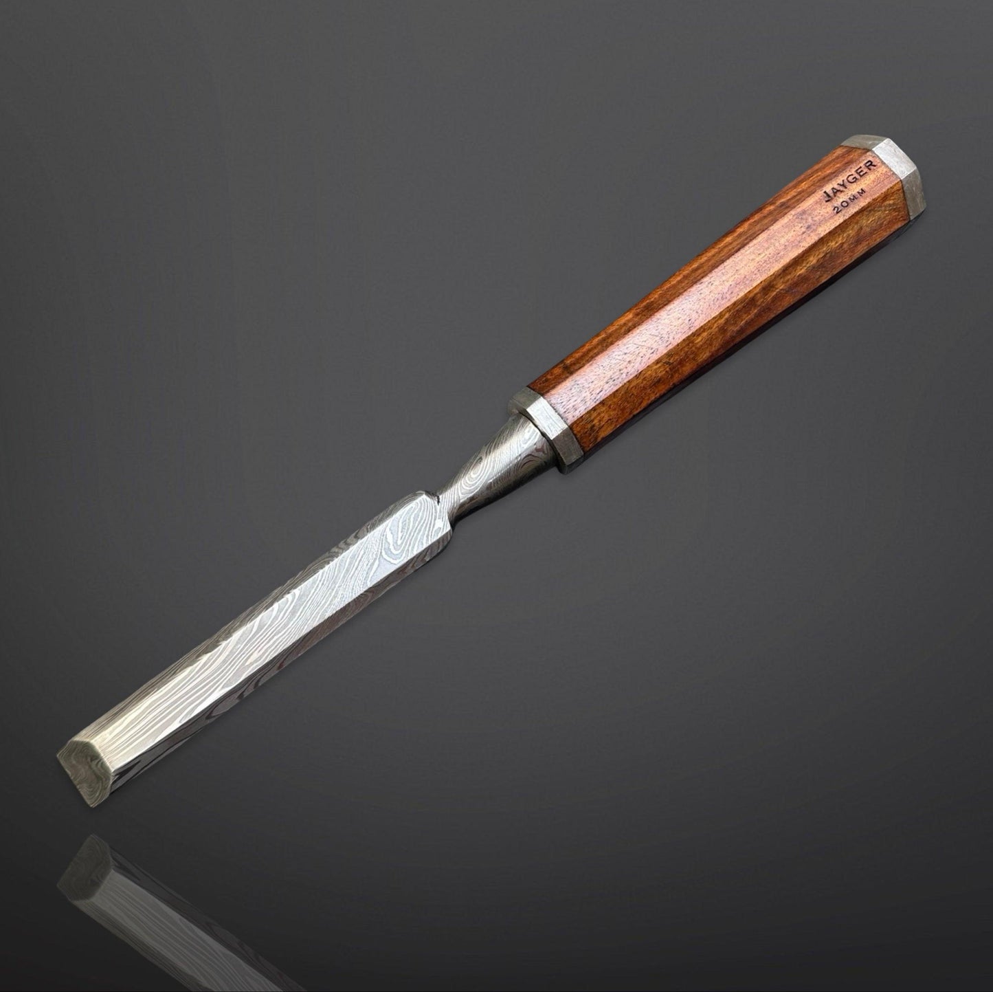 Wood chisel with wooden handle on a dark reflective surface