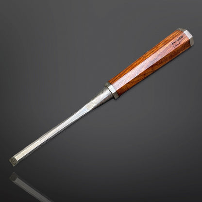 Wooden-handled chisel on a dark gray background