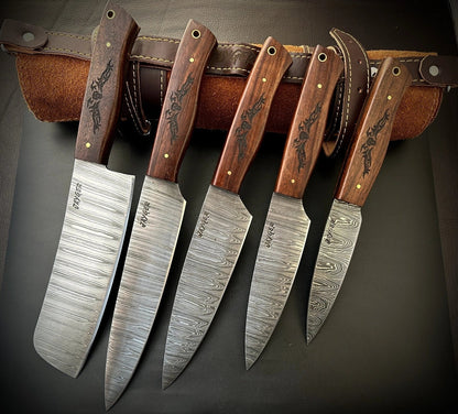 Set of five Damascus Steel knives with wooden handles on a dark background
